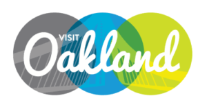Visit Oakland logo. Visit Oakland has been a client of Drew Bird Photo, an Oakland and San Francisco based evebt photographer.