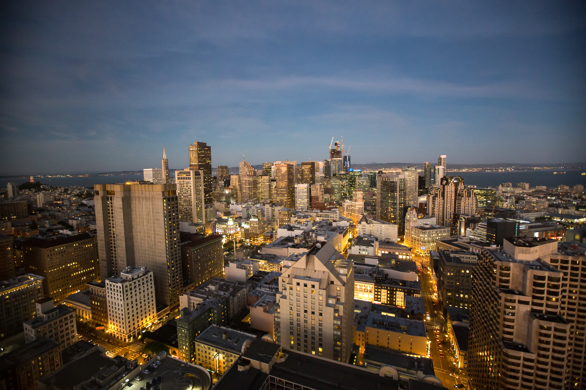 The downtown San Francisco city skyline at sunset from above. SF event photographer Drew Bird.
